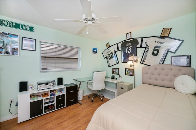 1 Sportsman Cir, Rotonda West, FL 33947 - bedroom with light wood-style flooring and a ceiling fan