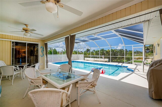 1 Sportsman Cir, Rotonda West, FL 33947 - outdoor pool with ceiling fan, a patio, glass enclosure, and outdoor dining space