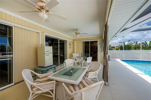 1 Sportsman Cir, Rotonda West, FL 33947 - sunroom / solarium with ceiling fan, wine cooler, and outdoor dining area