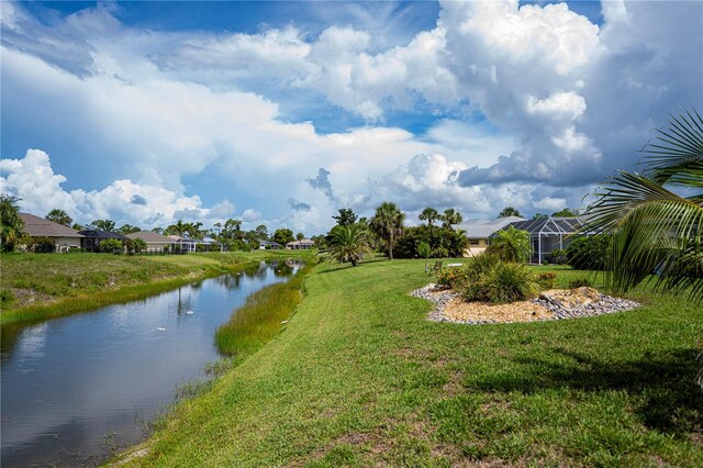 1 Sportsman Cir, Rotonda West, FL 33947 - view of grassy yard with a water view and a residential view
