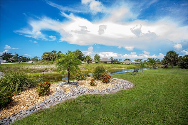 1 Sportsman Cir, Rotonda West, FL 33947 - view of grassy yard with a water view