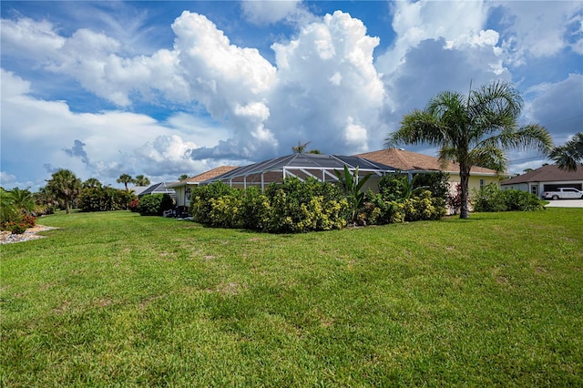 1 Sportsman Cir, Rotonda West, FL 33947 - view of green lawn with glass enclosure