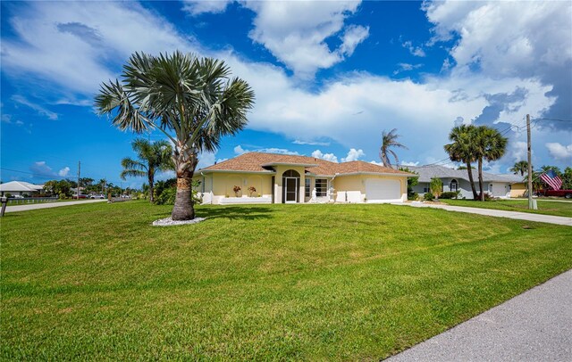 1 Sportsman Cir, Rotonda West, FL 33947 - single story home with concrete driveway, an attached garage, and a front lawn