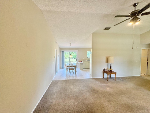 18335 Oxford Ave, Port Charlotte, FL 33948 - unfurnished room featuring light colored carpet, ceiling fan, a textured ceiling, and baseboards