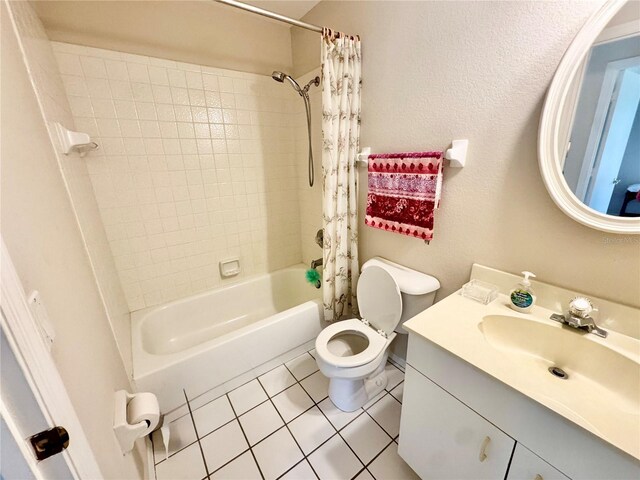 18335 Oxford Ave, Port Charlotte, FL 33948 - bathroom featuring tile patterned flooring, shower / bath combination with curtain, vanity, and toilet