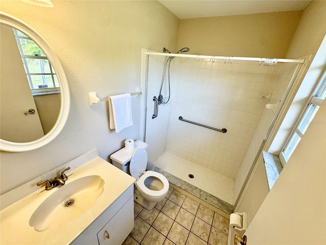 18335 Oxford Ave, Port Charlotte, FL 33948 - full bathroom featuring a tile shower, vanity, toilet, and tile patterned flooring