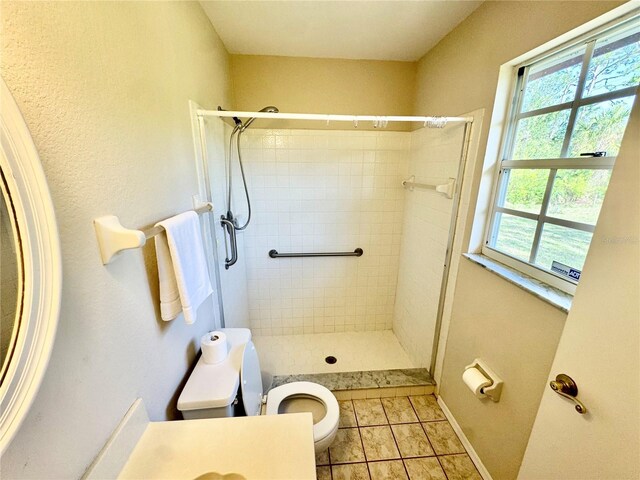 18335 Oxford Ave, Port Charlotte, FL 33948 - bathroom with toilet, a stall shower, and tile patterned flooring