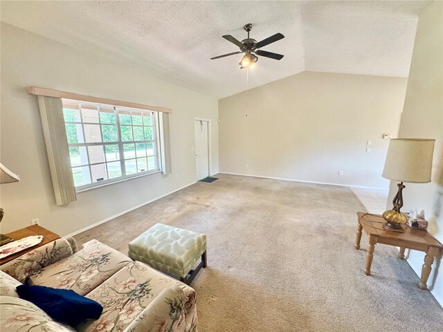 18335 Oxford Ave, Port Charlotte, FL 33948 - carpeted living area with lofted ceiling, ceiling fan, a textured ceiling, and baseboards