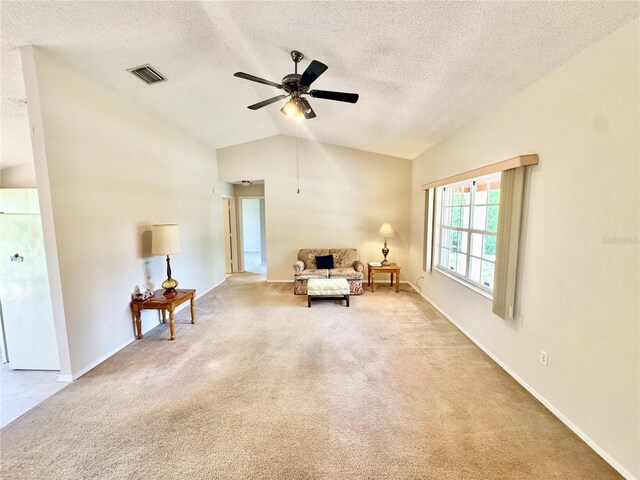 18335 Oxford Ave, Port Charlotte, FL 33948 - sitting room with vaulted ceiling, carpet, a ceiling fan, a textured ceiling, and baseboards