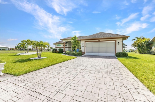 1499 Nuremberg Blvd, Punta Gorda, FL 33983 - view of front of property with decorative driveway, an attached garage, a front yard, and stucco siding