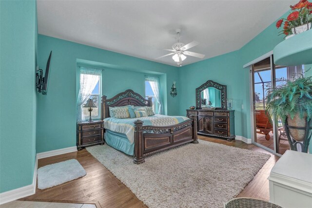 1499 Nuremberg Blvd, Punta Gorda, FL 33983 - bedroom featuring access to outside, baseboards, wood finished floors, and ceiling fan