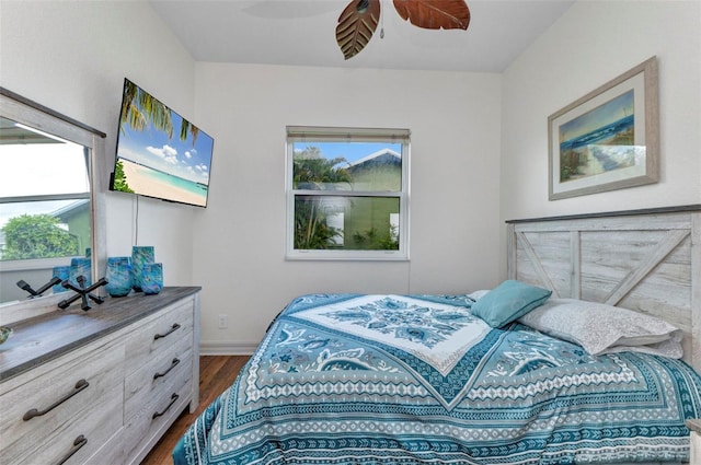 1499 Nuremberg Blvd, Punta Gorda, FL 33983 - bedroom with dark wood-style flooring, multiple windows, baseboards, and a ceiling fan
