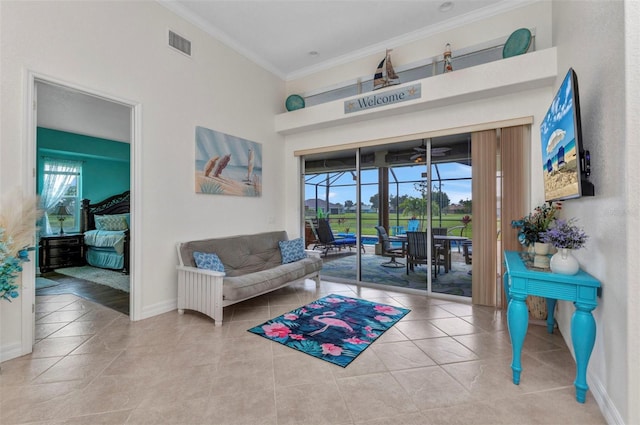1499 Nuremberg Blvd, Punta Gorda, FL 33983 - sitting room featuring crown molding, tile patterned flooring, healthy amount of natural light, and baseboards
