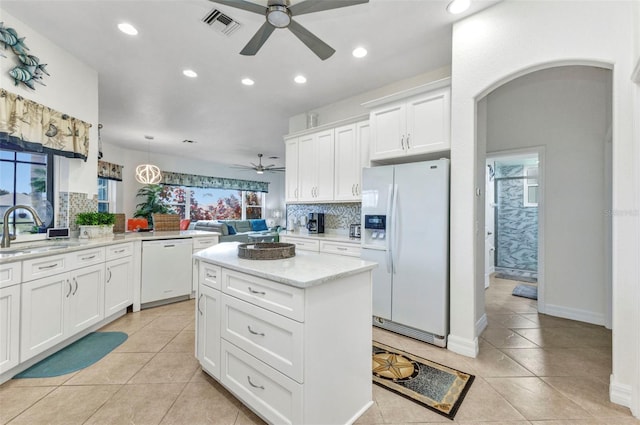 1499 Nuremberg Blvd, Punta Gorda, FL 33983 - kitchen with white appliances, a ceiling fan, a sink, decorative backsplash, and recessed lighting