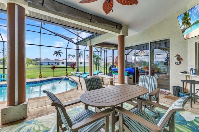 1499 Nuremberg Blvd, Punta Gorda, FL 33983 - view of patio / terrace featuring ceiling fan, a lanai, an outdoor pool, and outdoor dining area