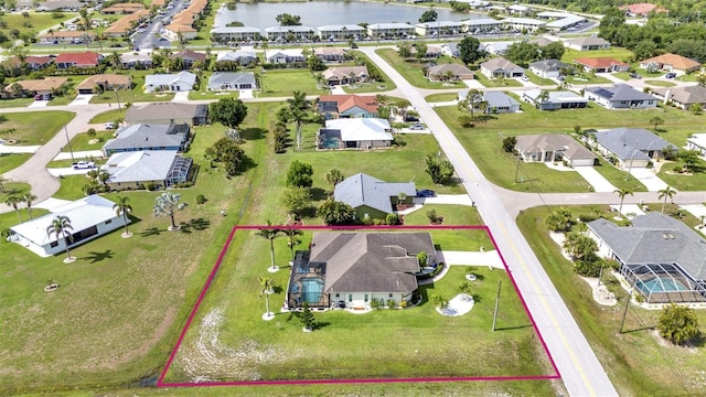 1499 Nuremberg Blvd, Punta Gorda, FL 33983 - aerial perspective of suburban area featuring a nearby body of water and property boundaries highlighted