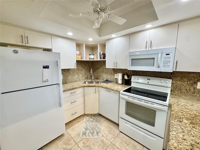 1515 Forrest Nelson Blvd Unit D102, Port Charlotte, FL 33952 - kitchen featuring white appliances, a sink, open shelves, backsplash, and recessed lighting