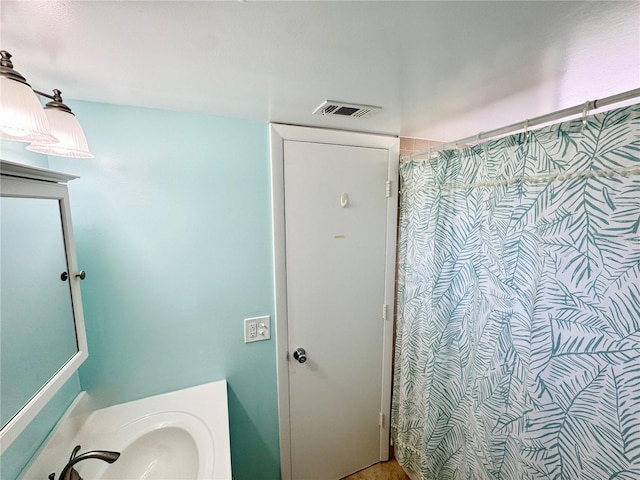1515 Forrest Nelson Blvd Unit D102, Port Charlotte, FL 33952 - bathroom featuring vanity and a shower with shower curtain