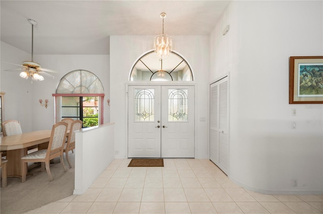 25371 Paladin Ln, Punta Gorda, FL 33983 - foyer featuring a chandelier, a ceiling fan, and light tile patterned floors