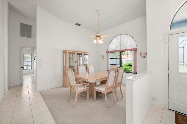 25371 Paladin Ln, Punta Gorda, FL 33983 - dining area with light tile patterned floors, a high ceiling, and ceiling fan