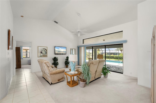 25371 Paladin Ln, Punta Gorda, FL 33983 - carpeted living room featuring high vaulted ceiling, ceiling fan, and tile patterned floors