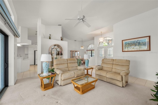 25371 Paladin Ln, Punta Gorda, FL 33983 - living room featuring a ceiling fan, light tile patterned flooring, light carpet, and high vaulted ceiling