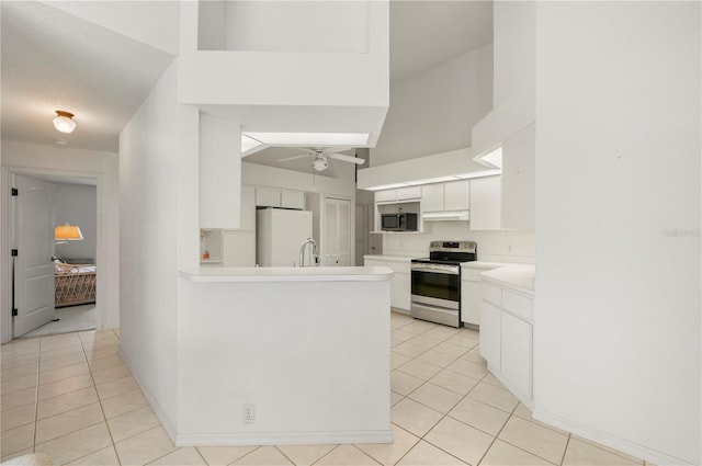 25371 Paladin Ln, Punta Gorda, FL 33983 - kitchen featuring electric range, freestanding refrigerator, a sink, light tile patterned floors, and a ceiling fan