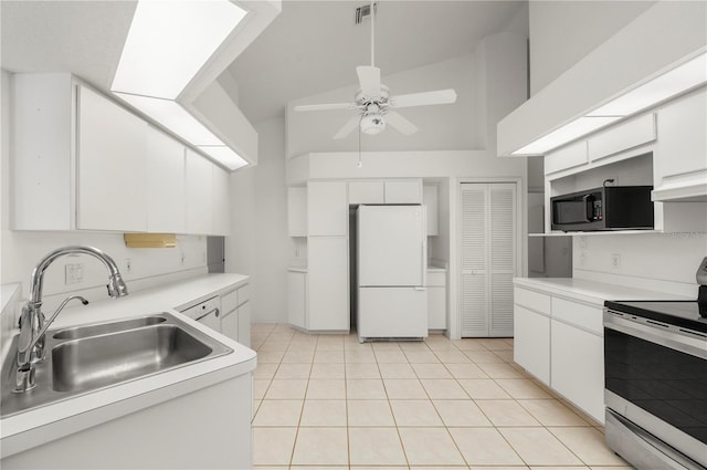 25371 Paladin Ln, Punta Gorda, FL 33983 - kitchen with appliances with stainless steel finishes, a sink, a ceiling fan, white cabinetry, and high vaulted ceiling