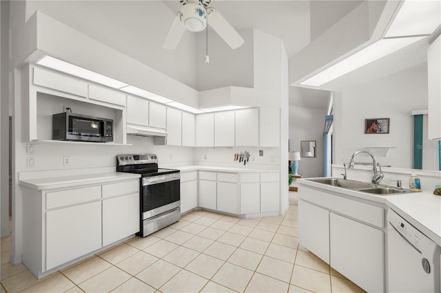 25371 Paladin Ln, Punta Gorda, FL 33983 - kitchen featuring appliances with stainless steel finishes, a sink, under cabinet range hood, light countertops, and light tile patterned floors