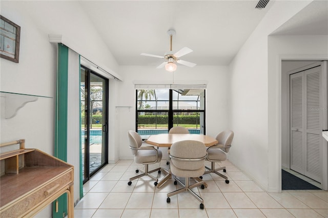 25371 Paladin Ln, Punta Gorda, FL 33983 - dining space featuring a ceiling fan, light tile patterned flooring, and baseboards