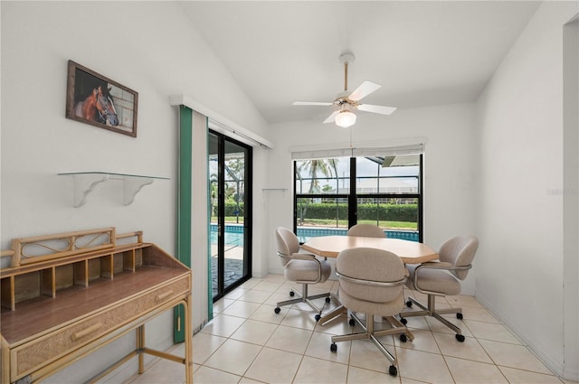 25371 Paladin Ln, Punta Gorda, FL 33983 - dining area with vaulted ceiling, ceiling fan, and light tile patterned floors