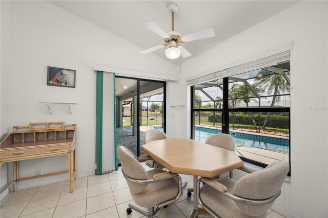 25371 Paladin Ln, Punta Gorda, FL 33983 - dining room featuring a ceiling fan, vaulted ceiling, a sunroom, and light tile patterned floors