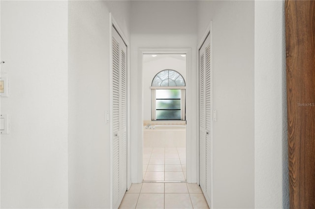 25371 Paladin Ln, Punta Gorda, FL 33983 - hallway featuring light tile patterned flooring