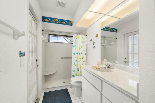 25371 Paladin Ln, Punta Gorda, FL 33983 - full bath featuring vanity, tile patterned floors, a tile shower, and toilet