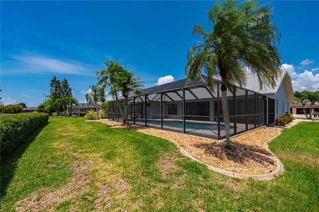 25371 Paladin Ln, Punta Gorda, FL 33983 - view of green lawn featuring an outdoor pool and a lanai