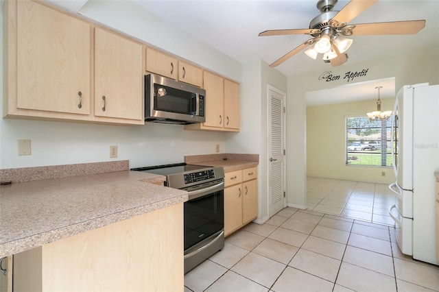 1472 Oriel Ct, Punta Gorda, FL 33983 - kitchen featuring stainless steel appliances, light brown cabinets, light countertops, a ceiling fan, and light tile patterned floors
