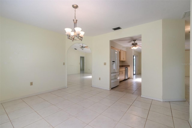 1472 Oriel Ct, Punta Gorda, FL 33983 - empty room with ceiling fan, a chandelier, arched walkways, and light tile patterned flooring