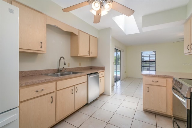 1472 Oriel Ct, Punta Gorda, FL 33983 - kitchen featuring stainless steel appliances, light brown cabinets, a sink, and light countertops
