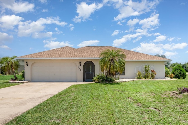 1472 Oriel Ct, Punta Gorda, FL 33983 - ranch-style home with stucco siding, an attached garage, concrete driveway, and a front yard