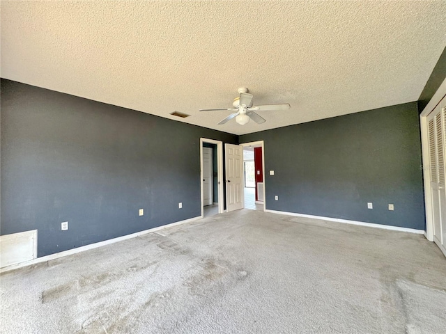 1611 Robbins Rd, Nokomis, FL 34275 - unfurnished bedroom featuring carpet flooring, a textured ceiling, baseboards, a ceiling fan, and a closet