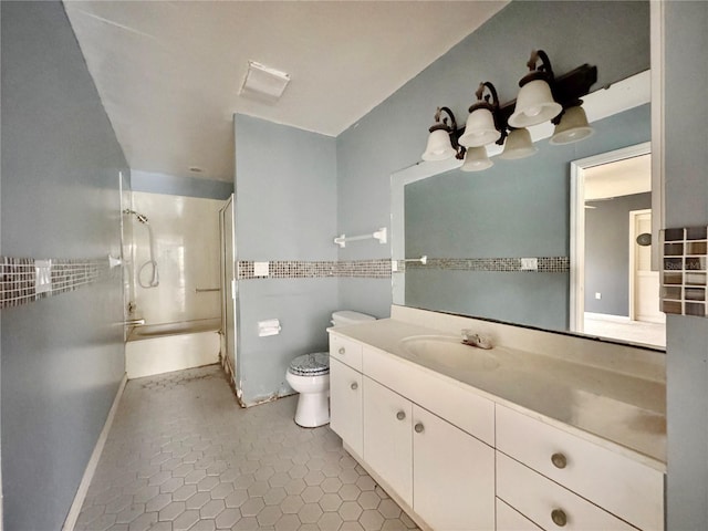 1611 Robbins Rd, Nokomis, FL 34275 - bathroom featuring toilet, vanity, tub / shower combination, and tile patterned floors