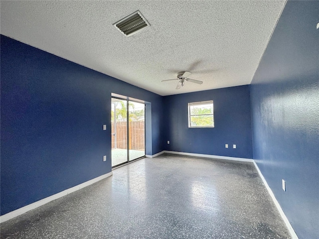 1611 Robbins Rd, Nokomis, FL 34275 - empty room featuring healthy amount of natural light, a ceiling fan, baseboards, and a textured ceiling