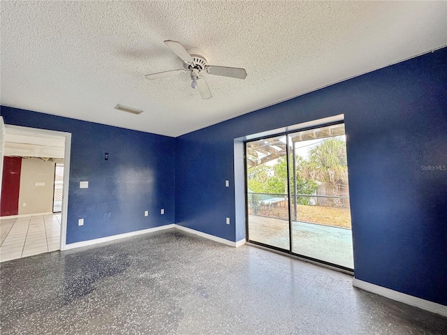 1611 Robbins Rd, Nokomis, FL 34275 - empty room featuring ceiling fan, a textured ceiling, baseboards, and speckle patterned floor