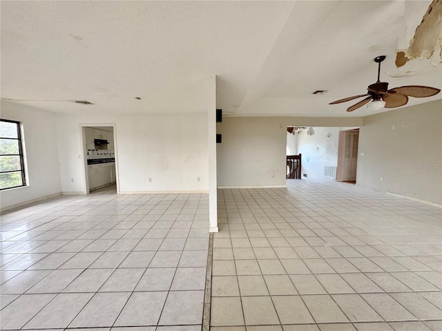 1611 Robbins Rd, Nokomis, FL 34275 - empty room featuring a ceiling fan, light tile patterned floors, and baseboards