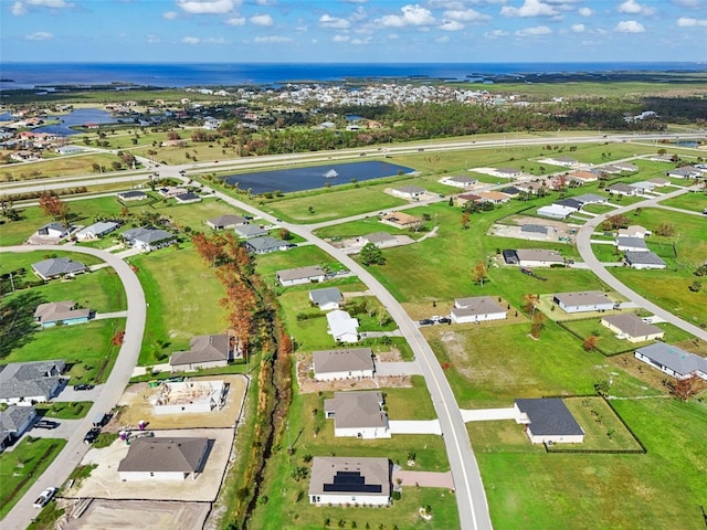 aerial view of residential area with a nearby body of water
