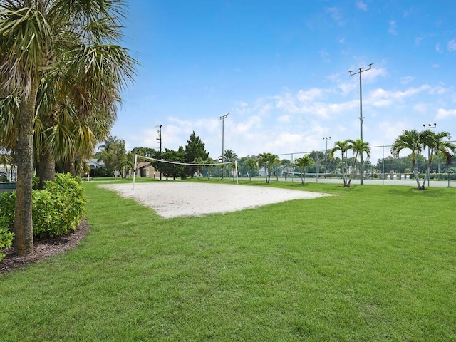 13281 Whitehaven Ln Unit 404, Fort Myers, FL 33966 - view of home's community with volleyball court and a yard