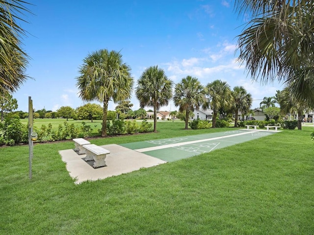 13281 Whitehaven Ln Unit 404, Fort Myers, FL 33966 - surrounding community with shuffleboard and a lawn