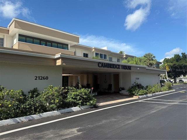 21260 Brinson Ave Unit 110, Port Charlotte, FL 33952 - view of building exterior featuring a parking lot