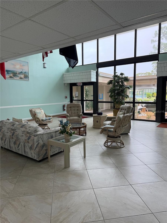 21260 Brinson Ave Unit 110, Port Charlotte, FL 33952 - tiled living area with healthy amount of natural light and floor to ceiling windows