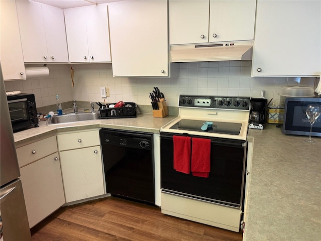 21260 Brinson Ave Unit 110, Port Charlotte, FL 33952 - kitchen featuring dishwasher, range with electric stovetop, under cabinet range hood, light countertops, and white cabinets